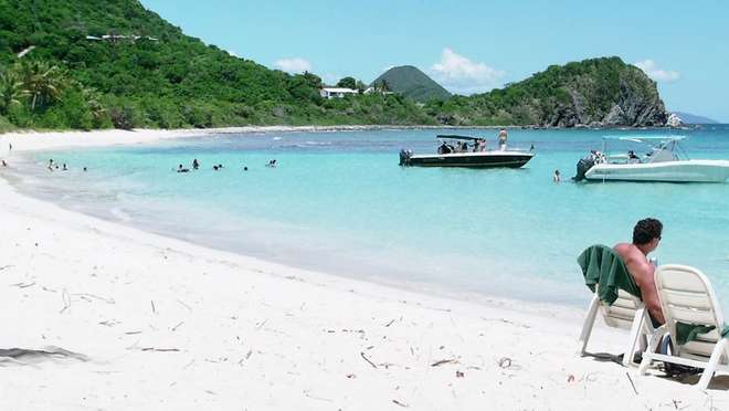 Feel warm ocean breezes on Tortola's soft sands