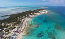 Feel warm ocean breezes on soft white sand