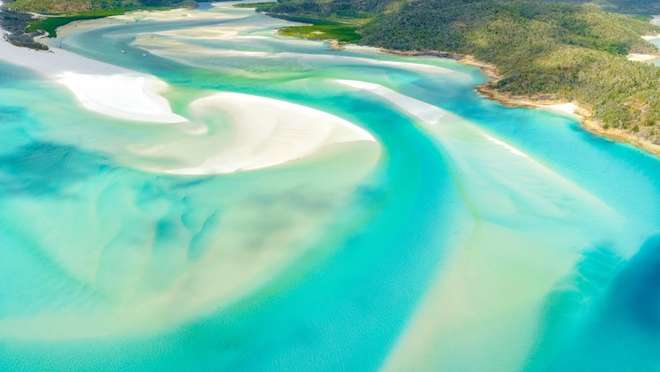 Bask in warm ocean breezes on soft sandy beaches