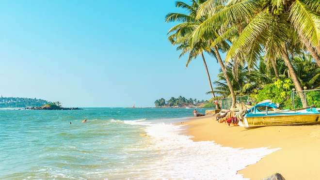 Feel warm ocean breezes on soft white sand