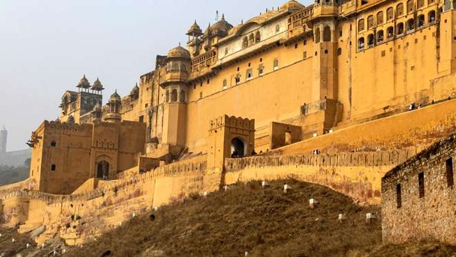 Marvel at golden sandstone palace walls