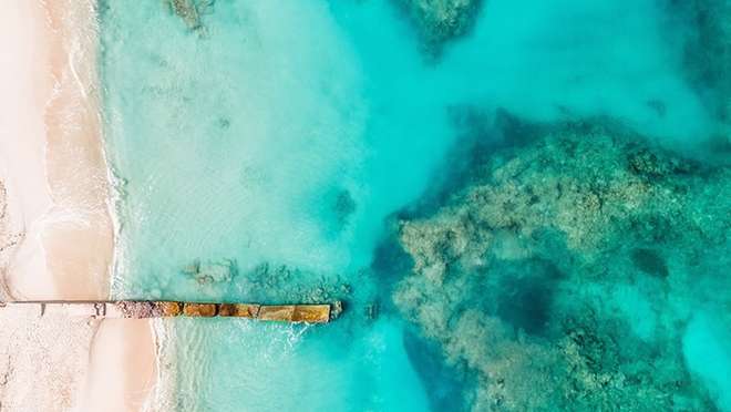Sink your toes into warm, soft sand in Grand Turk